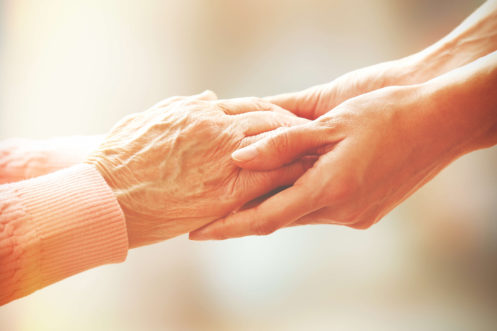 Two People Holding Hands