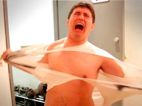 man ripping off shirt