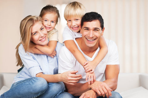 Family is smiling for picture