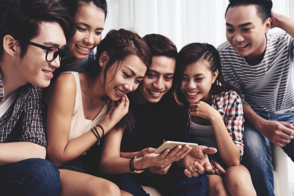 group of friends watching youtube
