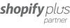 Shopify Plus Partner logo in gray text on a transparent background.