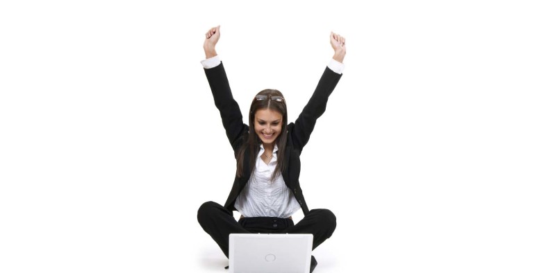 woman excited looking at computer