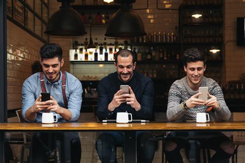 three male friends on phone watching youtube about small businesses