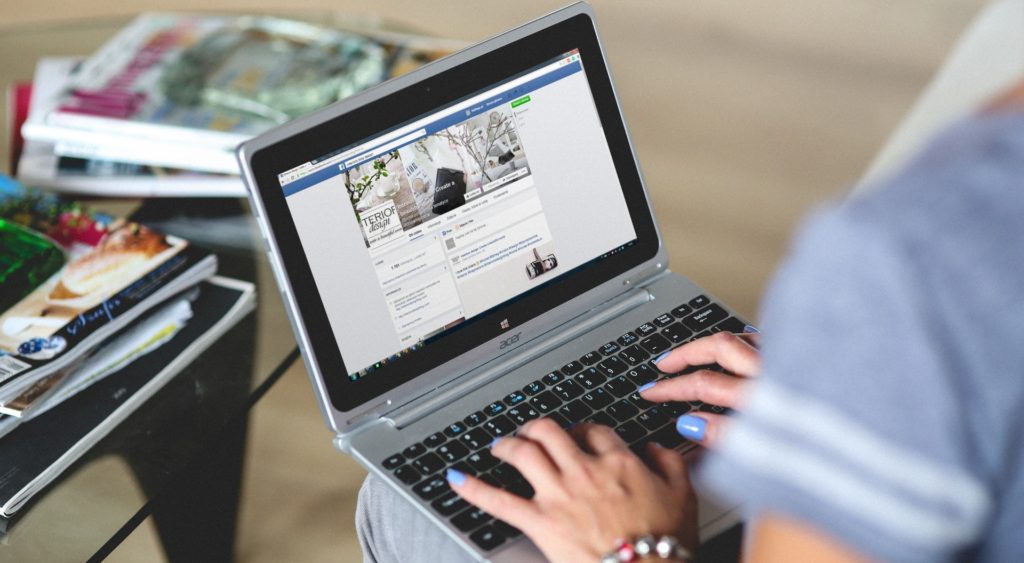 woman browsing facebook company page