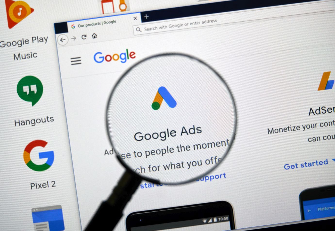 magnifying glass enlarging Google Ads icon