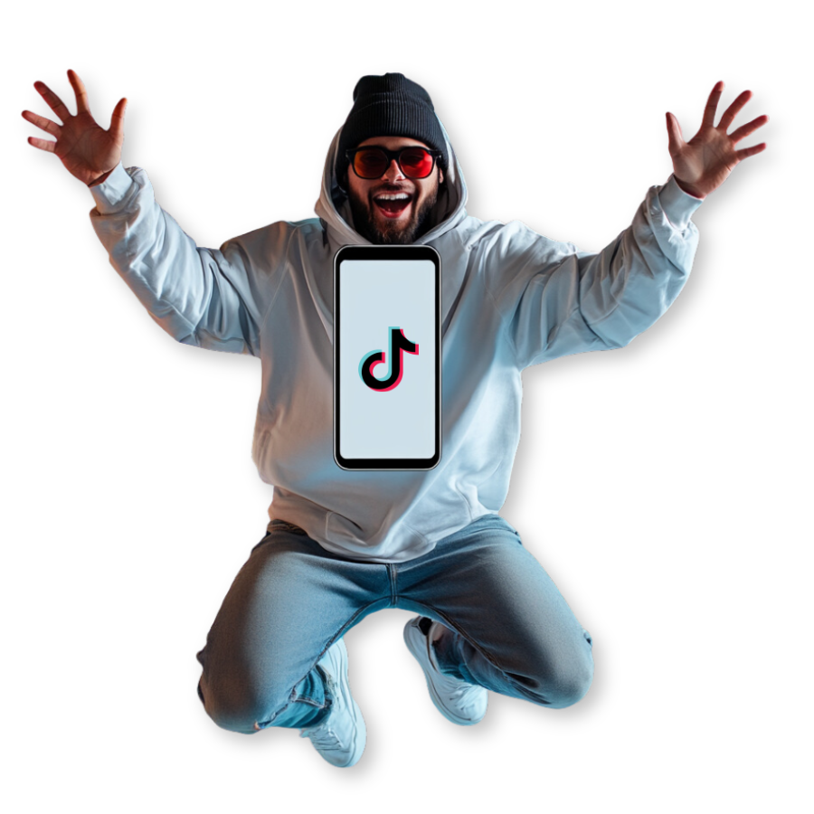 A person in a hoodie, beanie, sunglasses, and jeans, jumping with arms raised enthusiastically. A phone with the TikTok logo is superimposed on their chest, showcasing the power of TikTok marketing.